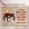 A Crazy Dog Lady And Her Grumpy Old Man Live Here - Personalized Decorative Mat